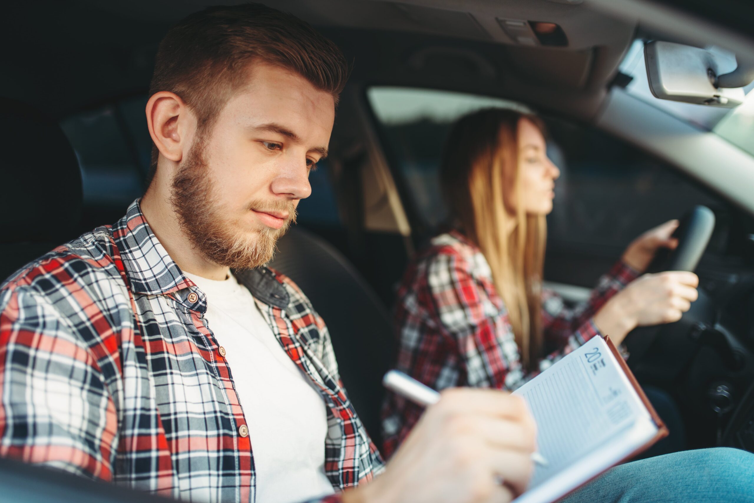 About Us 2 male instructor and female student driving lesson 2021 08 26 16 26 39 utc min scaled